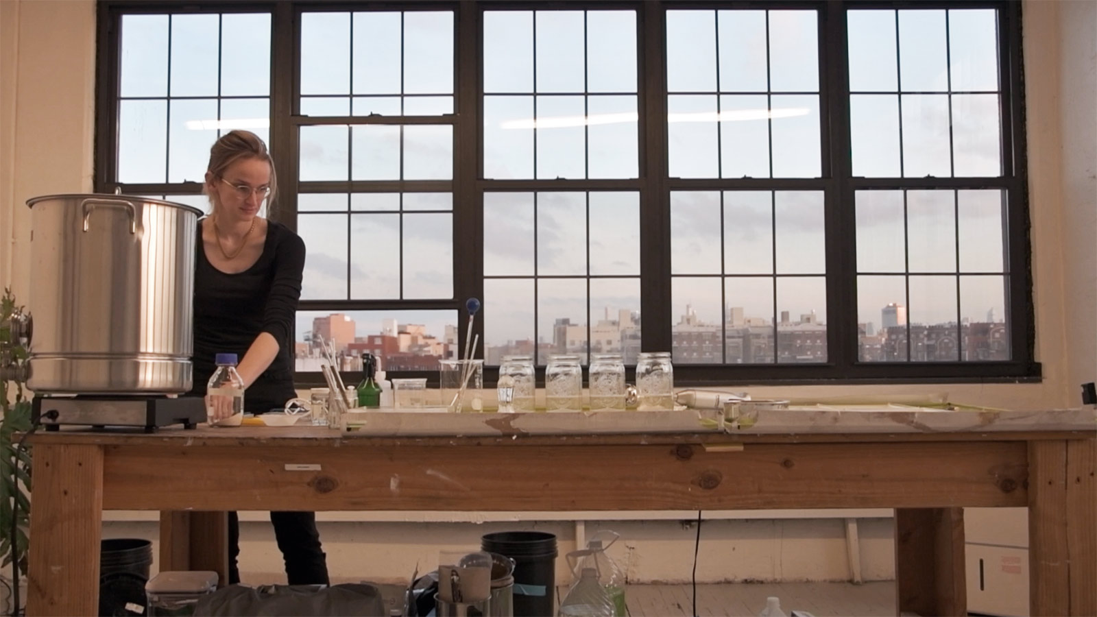 "I come from thinking about formal sustainability strategy, but then I realized that the real gap and the real challenge we had was in creating visions of workable, livable futures, so that we could have a collective vision we could pull towards as a society. That’s really creative work," said Charlotte McCurdy in her studio in collaboration with fashion designer Phillip Lim in making the algae sequin dress. Image by the team of One X One Official Website.