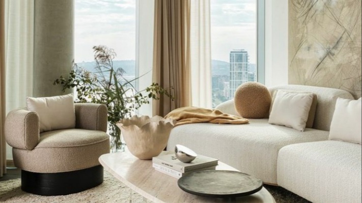 The light cream sofas of Dara Huang furniture line in partnership with Perennials Southerland LLC. Image by: Muse Motion Pictures