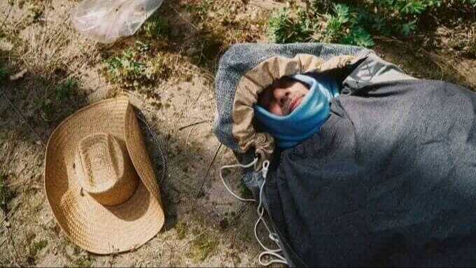 The Sheltersuit is a water- and windproof jacket with a detachable sleeping bag for the homeless and others in need. It comes in a duffle bag to carry. Image of Sheltersuit Foundation.